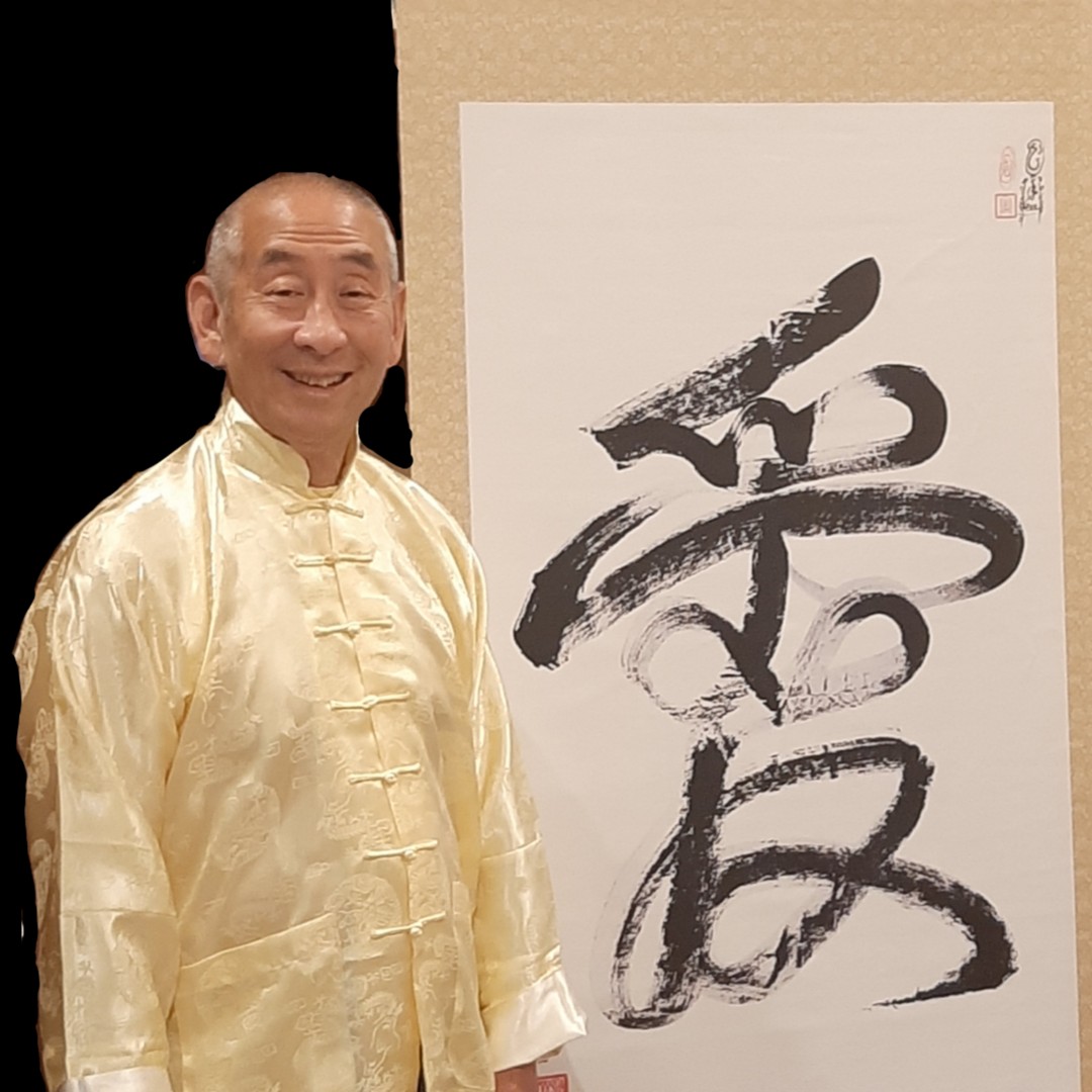 Shimosaka Healing Services practitioner with calligraphy art